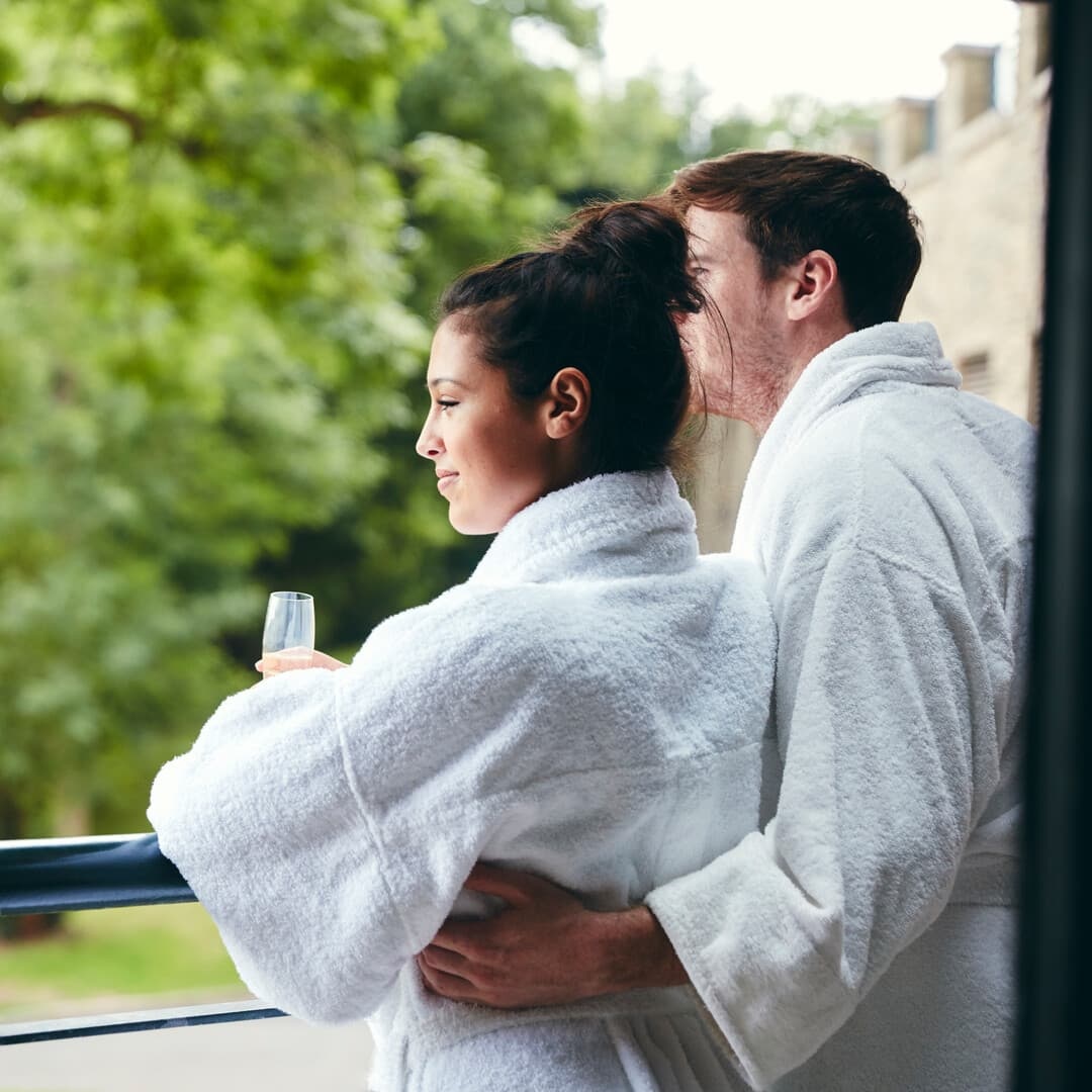 Couple in Robes on Balcony