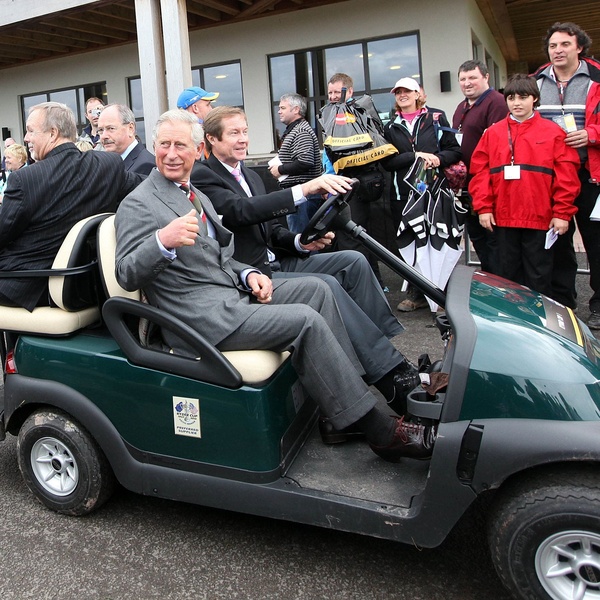 Prince Charles tours the Ryder Cup venue by golf buggy with the site owner Sir Terry Matthews